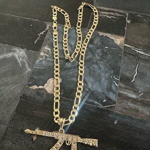 Gold Chain Necklace with Gun Pendant